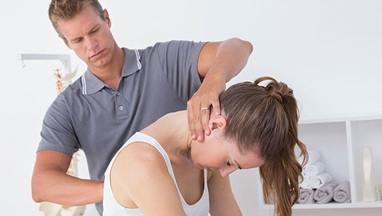 Woman receiving chiropractic adjustment from a Brentwood chiropractor