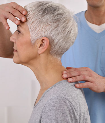 Patient receiving chiropractic adjusmtent for migraine relief from Brentwood Chiropractors