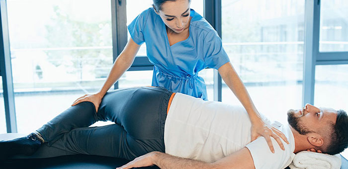 Patient receiving sciatica treatment from Brentwood chiropractor