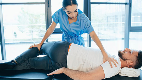 Patient receiving sciatica treatment from Brentwood chiropractor